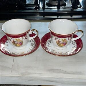 Two Handarbeit (Bavaria Germany) tea cups with saucers